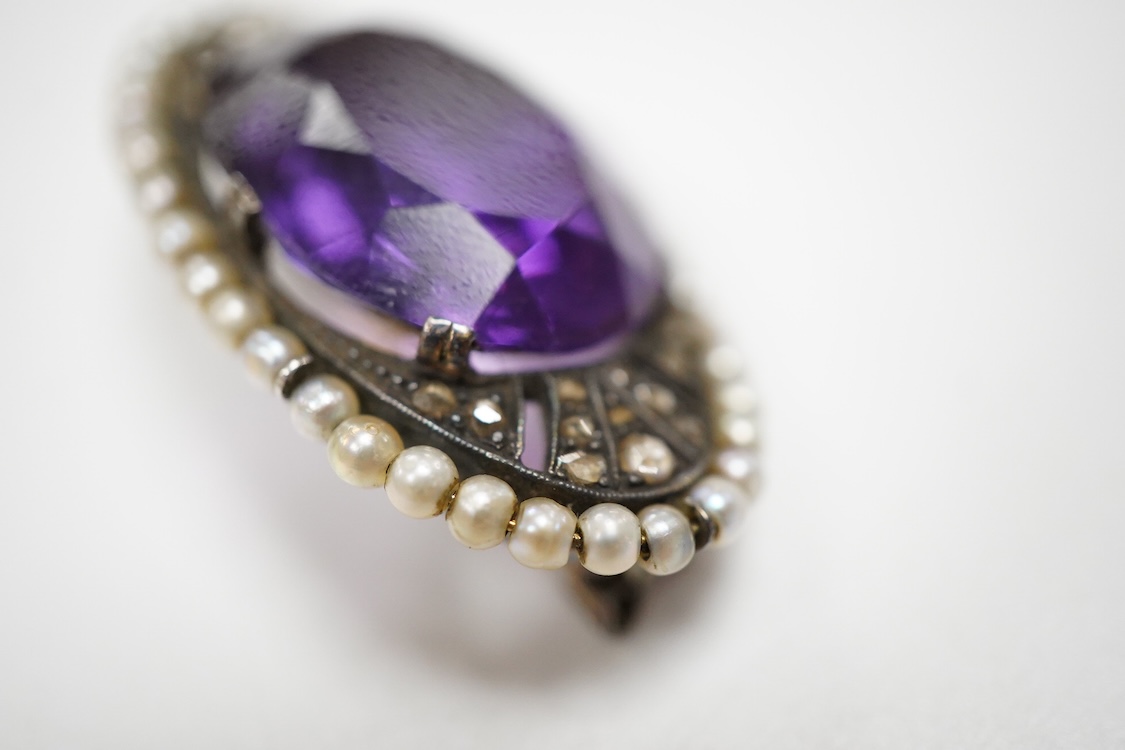 An early 20th century Austro-Hungarian 14k, amethyst, diamond and seed pearl set oval brooch, 37mm, gross weight 10 grams.